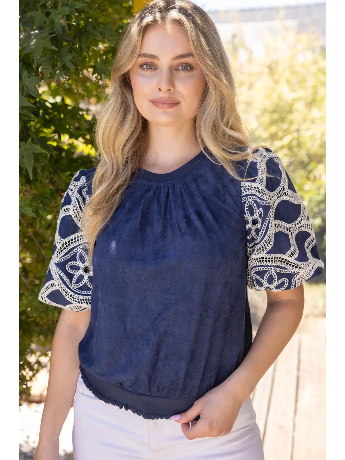 Dark blue crochet-sleeve suede top back view