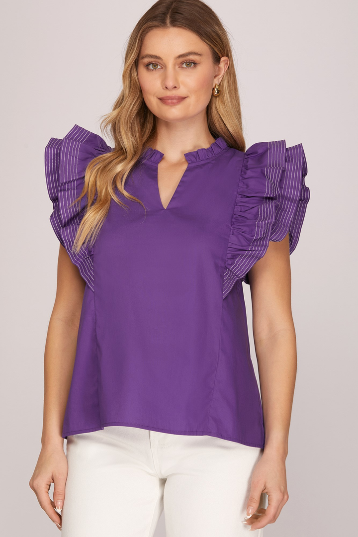 Model wearing purple ruffle-stitch cotton top