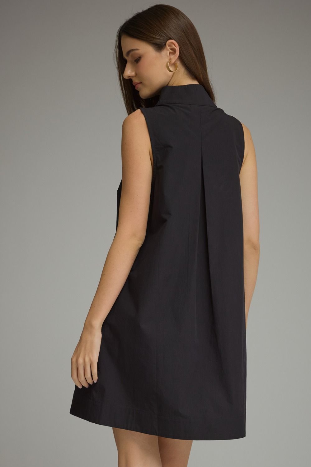 Black sleeveless split-neck mini dress with a stand collar and relaxed shift silhouette