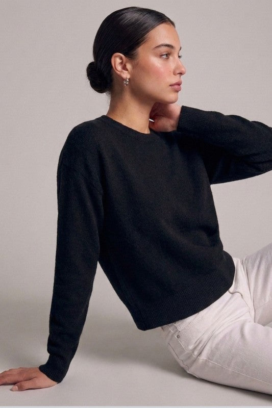 Black crewneck sweater relaxed fit side view