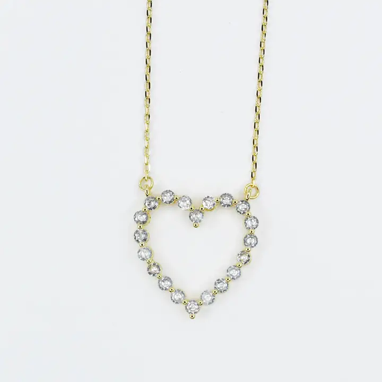 18K gold heart necklace with a diamond-studded outline on a delicate chain.