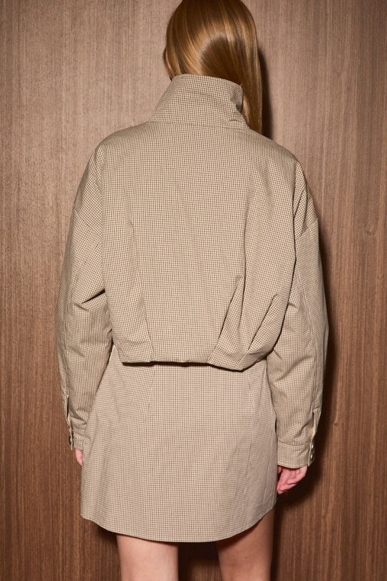 Taupe plaid insulated jacket showing the relaxed back fit