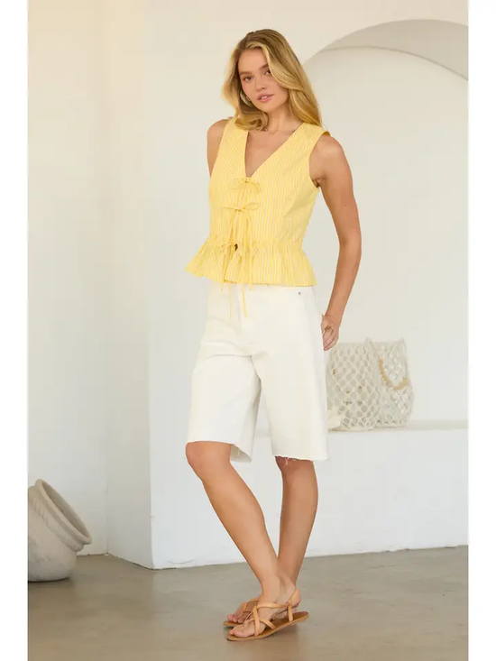 SLEEVELESS TIE FRONT PEPLUM