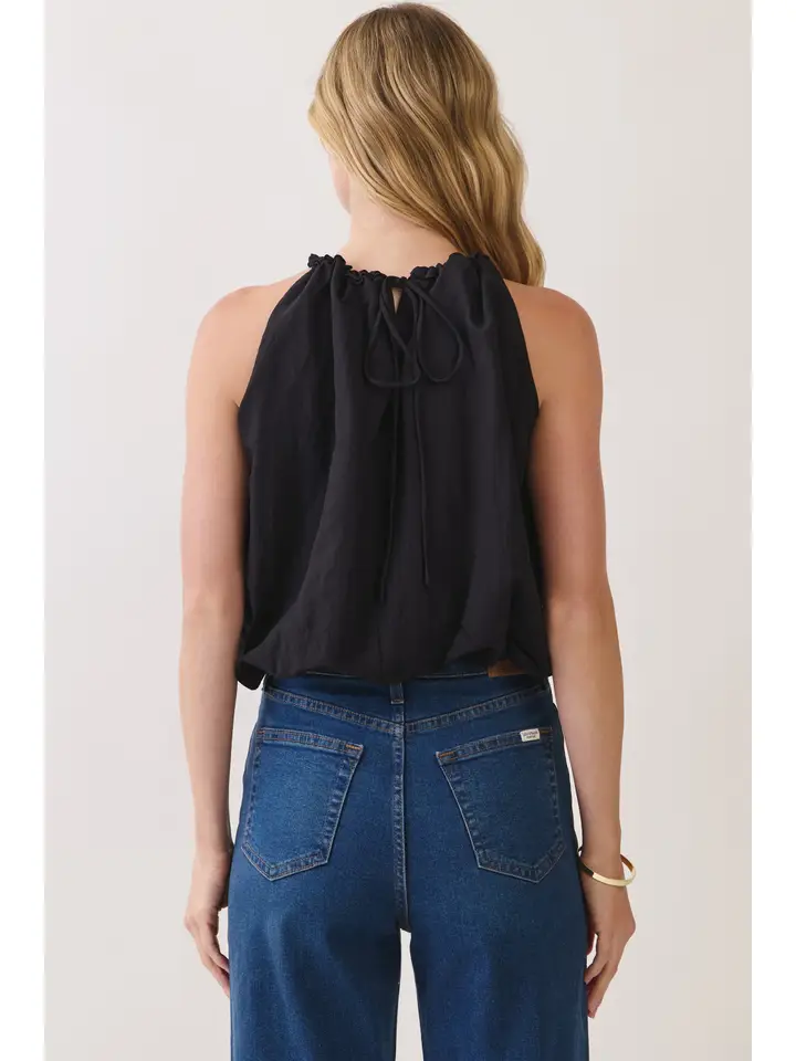 Black halter balloon top, back styling view