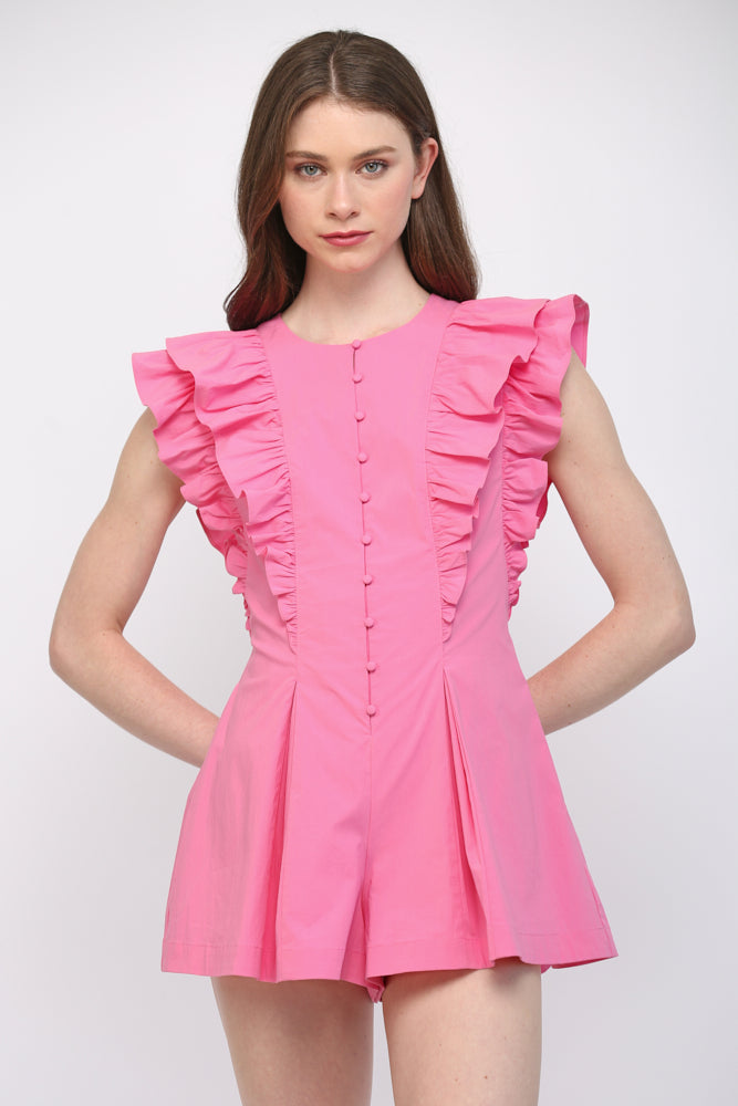 Model wearing hot pink ruffle-detail pleated romper