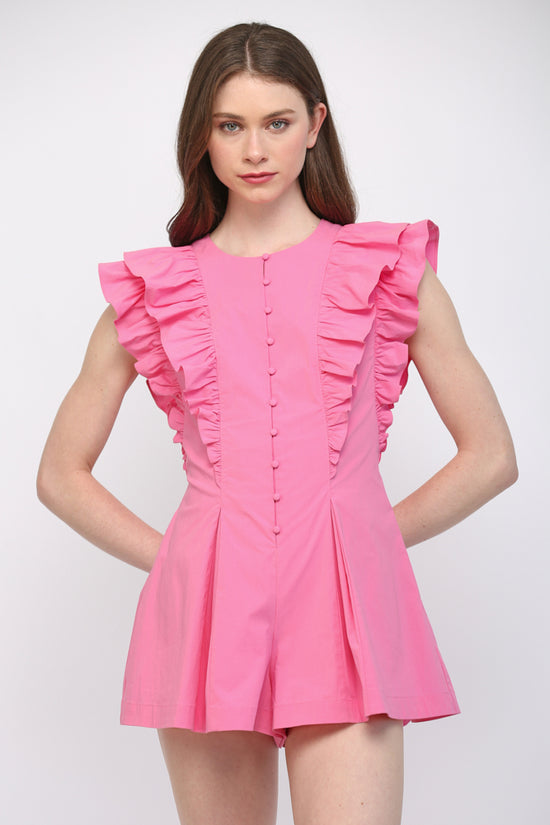 Model wearing hot pink ruffle-detail pleated romper