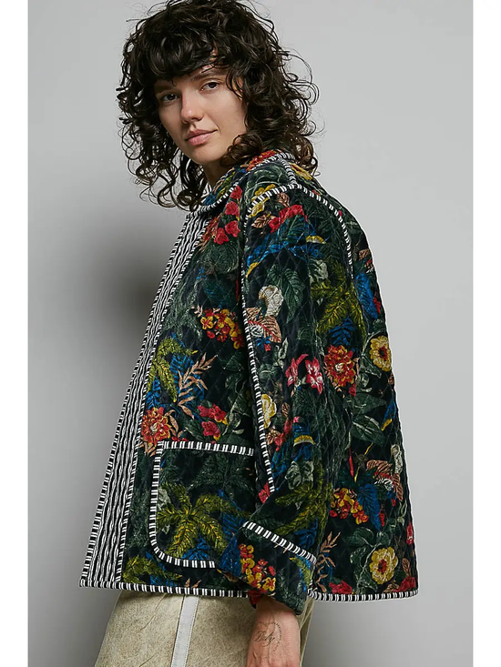 Black floral quilted open-front jacket on model, side view