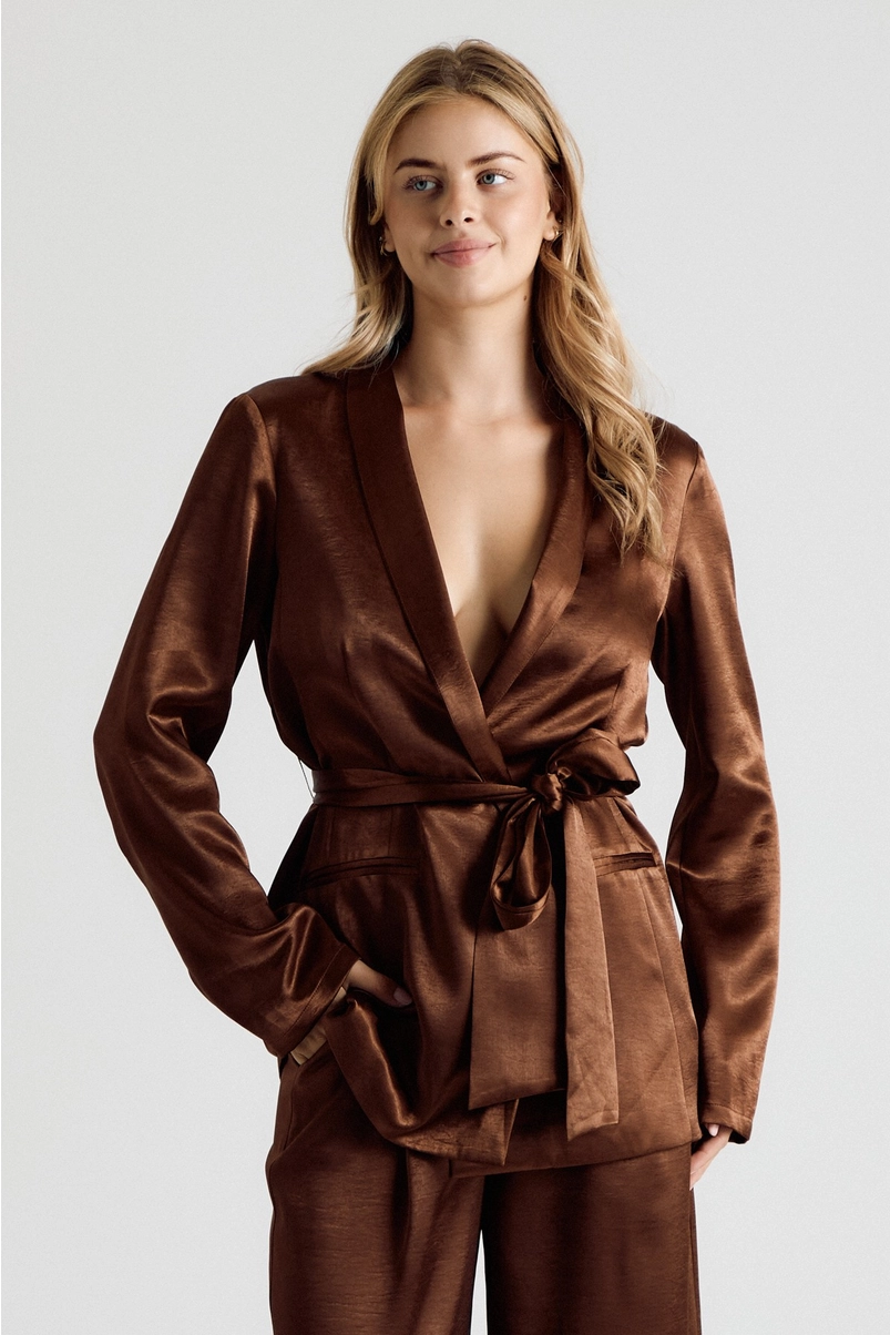 Front view of chocolate brown satin belted blazer