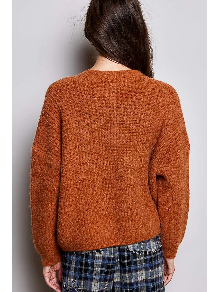 Orange V-neck cardigan on model, back view
