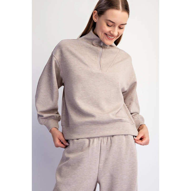 Weekend quarter-zip pullover showing gathered cuffs and banded hem