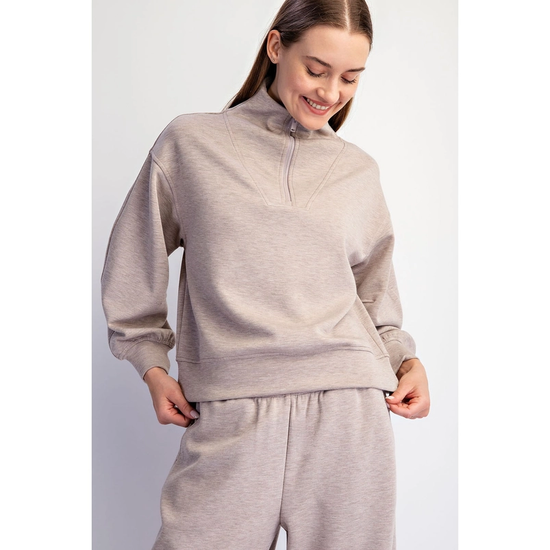 Weekend quarter-zip pullover showing gathered cuffs and banded hem
