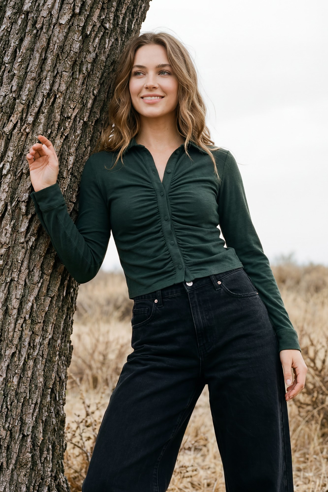 Model wearing salamander shirred button-up top