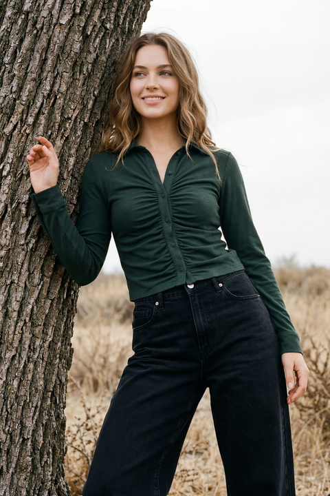 Model wearing salamander shirred button-up top