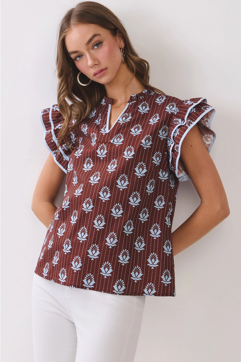 Model wearing brown floral flutter-sleeve top