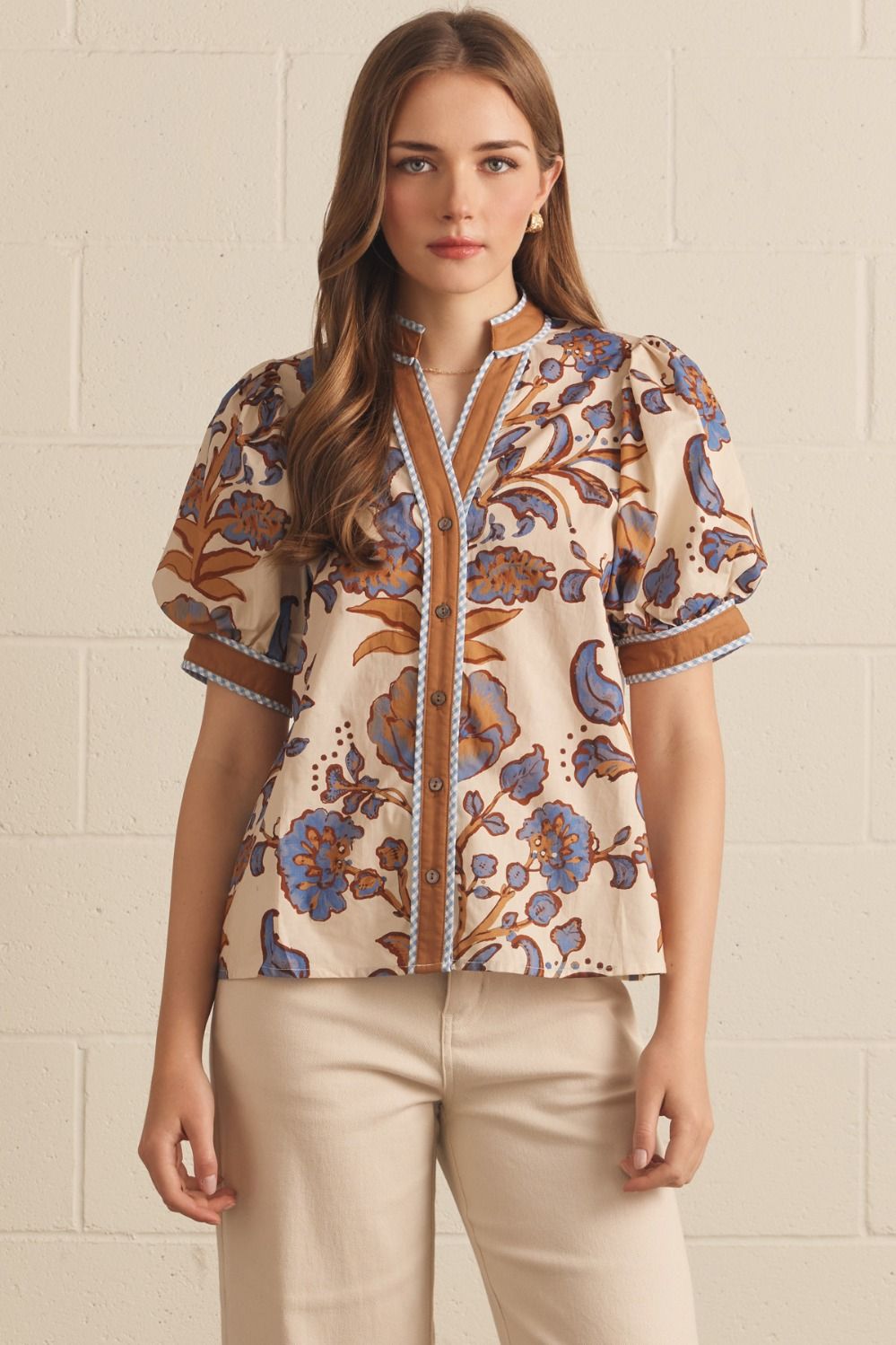 Ivory floral contrast-trim top with a ruffled split neckline and short puff sleeves