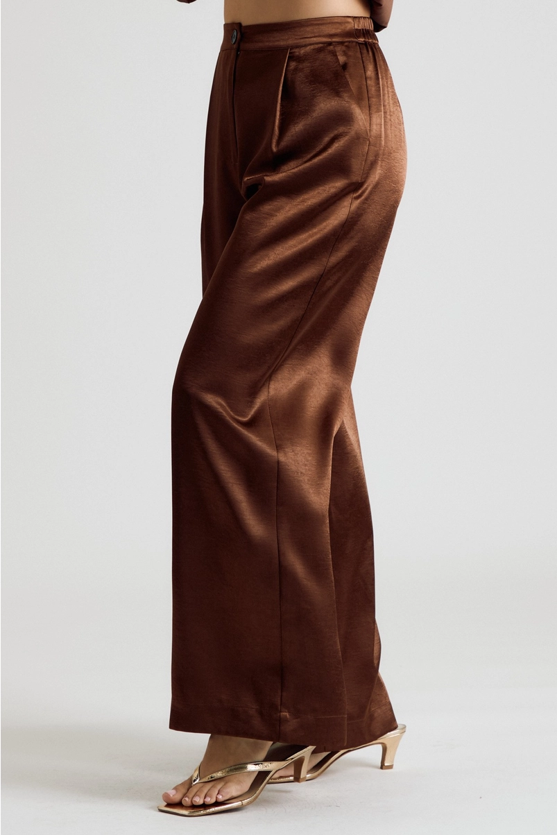 Side view of brown satin wide-leg trousers