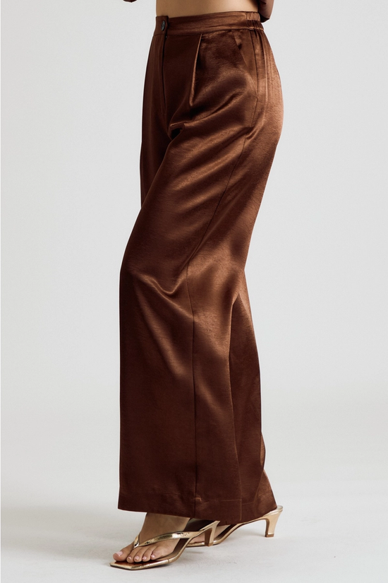 Side view of brown satin wide-leg trousers