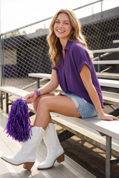 Model wearing purple drop-shoulder collared top