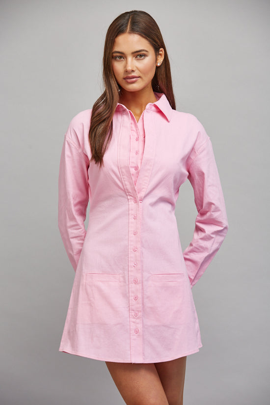 Model wearing pink structured A-line shirt dress
