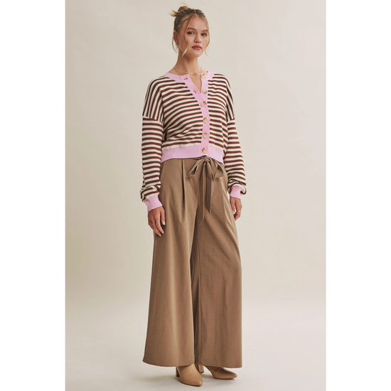 Angled front view of striped button-front cardigan with dropped shoulders