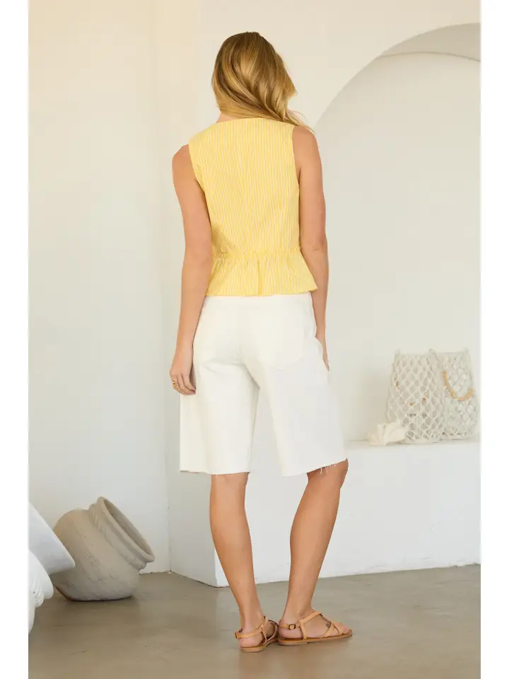 SLEEVELESS TIE FRONT PEPLUM