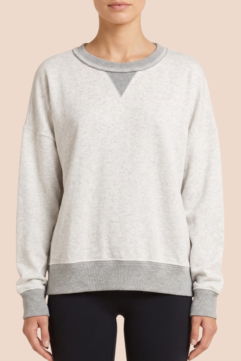 Model wearing light grey contrast-trim sweatshirt and shorts set