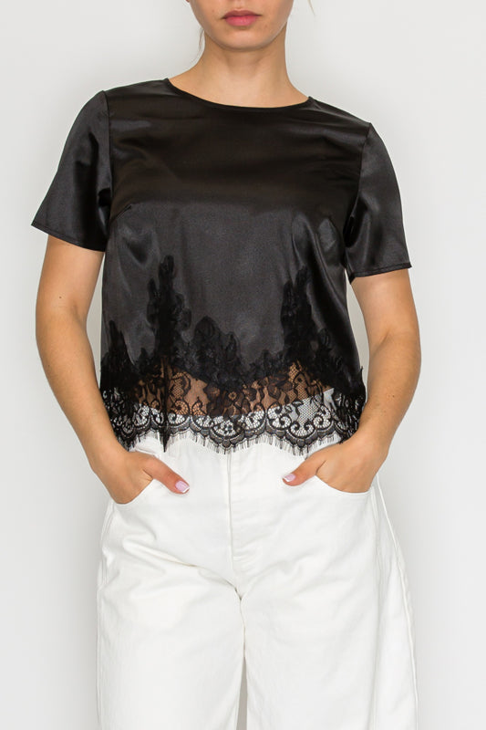 Model wearing black lace-detail satin top