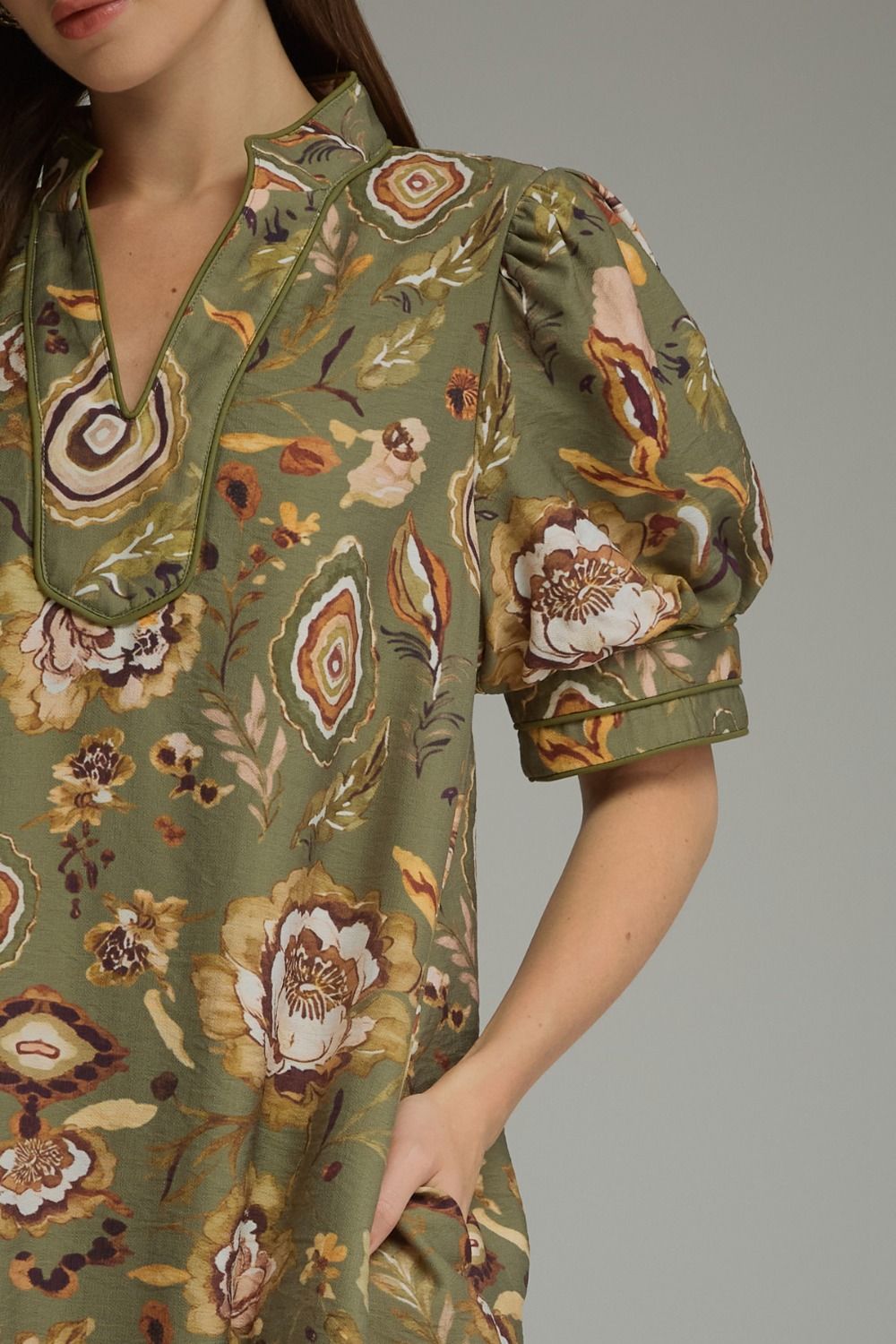 Green botanical mini dress by Entro, print detail